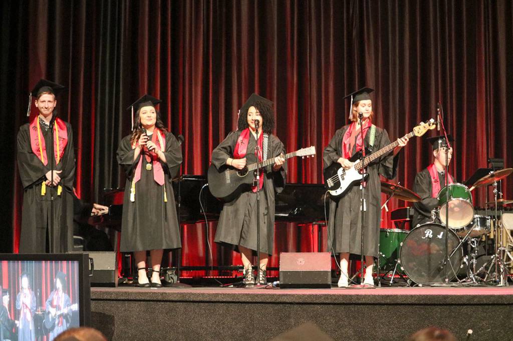 A group of students perform &ldquo;Many the Miles&rdquo; during the graduation ceremony.                                (Evan Pappas/Staff Photo)