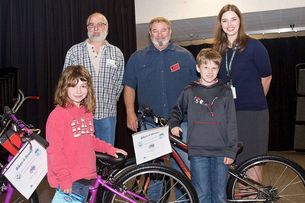 North Bend Elementary honored its Bikes for Books winners June 13. Pictured from left are Aryanna Braddock Finch, first grader, Jonathan Seaton and Mark Goodwin of the Unity Lodge, Drew Berow, third grade and Stephanie Shepherd, Principal.                                Courtesy Photo
