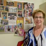 &ldquo;When things get to me, I just look at my reason wall,&rdquo; Jodi Warren says. The wall of photos of her family, husband Jerry, two sons and a daughter, and six grandchildren always makes her happy. Carol Ladwig/Staff Photo