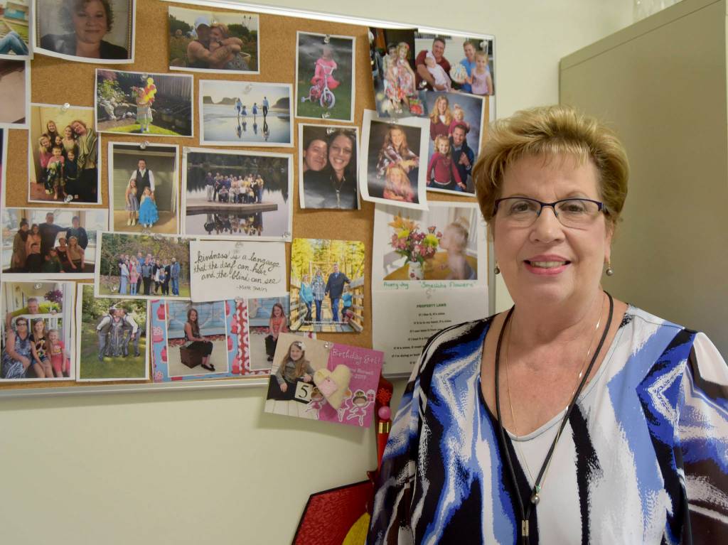 &ldquo;When things get to me, I just look at my reason wall,&rdquo; Jodi Warren says. The wall of photos of her family, husband Jerry, two sons and a daughter, and six grandchildren always makes her happy. Carol Ladwig/Staff Photo