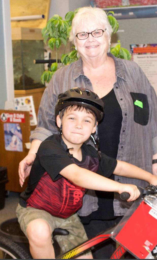 Second grader Darron Christianson, pictured with his grandmother, Carole, is a 2017 Bikes for Books winner at Fall City Elementary.                                Courtesy Photo