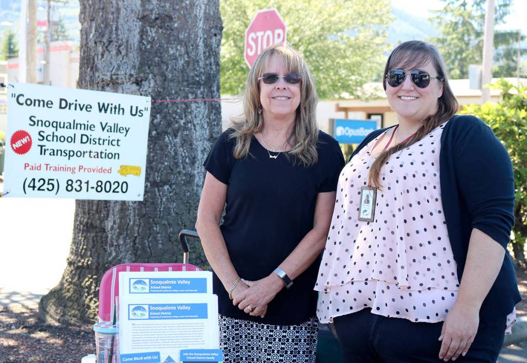 Karen Lewis and Erin Davies, representing the Snoqualmie Valley School District, were focused on filling transportation jobs such as school bus drivers.                                (Evan Pappas/Staff Photo)