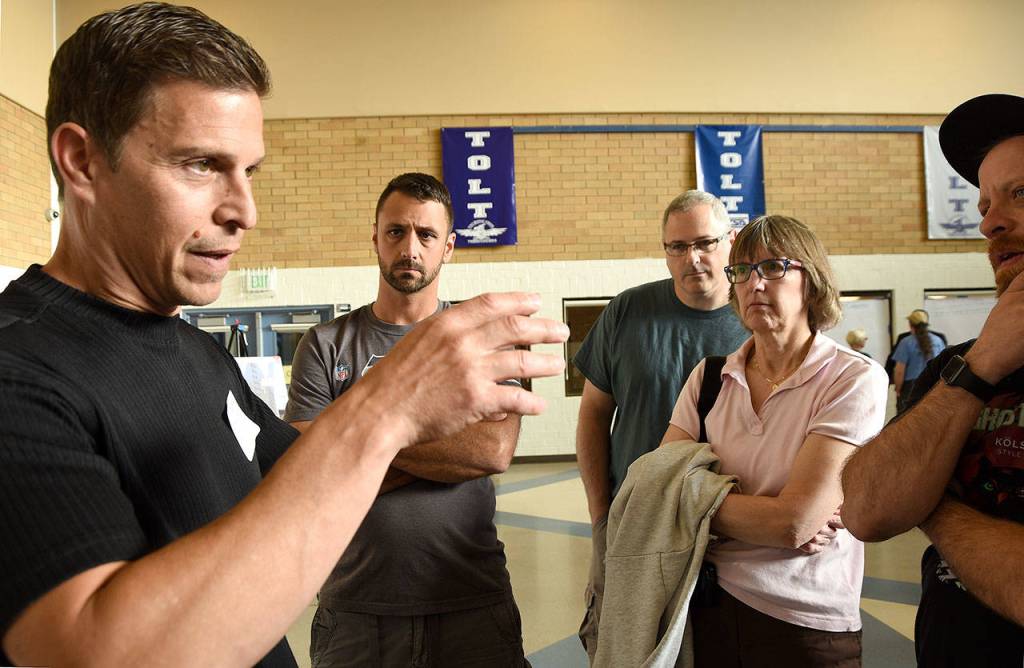 Road engineer Larry Jaramillo explains the problem on the bridge, the connections of the bridge deck to the supports were made with too-small bolts and not enough of them.                                Carol Ladwig/Staff Photo