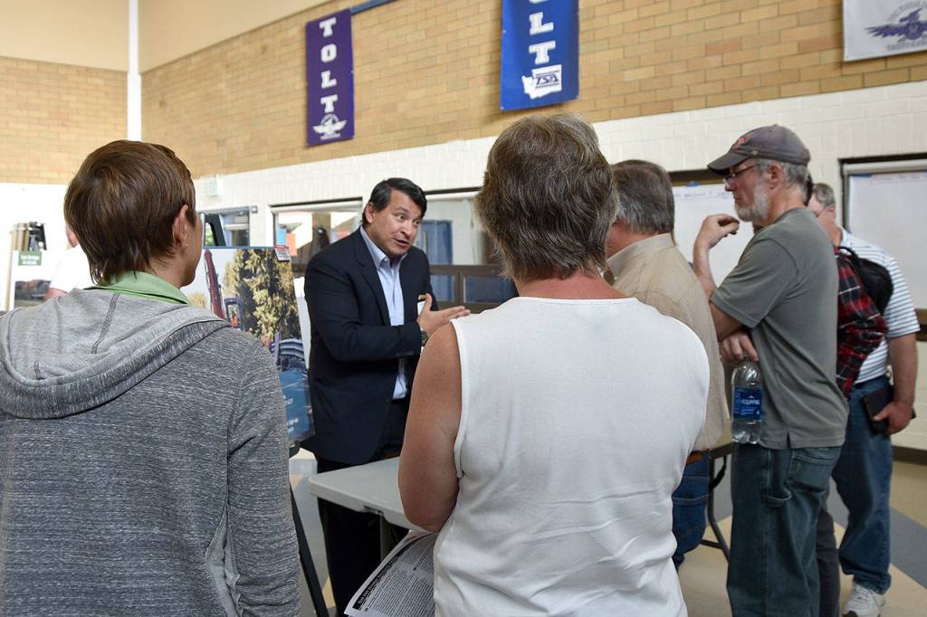 Jerome Pionk with the King County Roads Division discusses the problem of the bridge.                                Carol Ladwig/Staff Photo