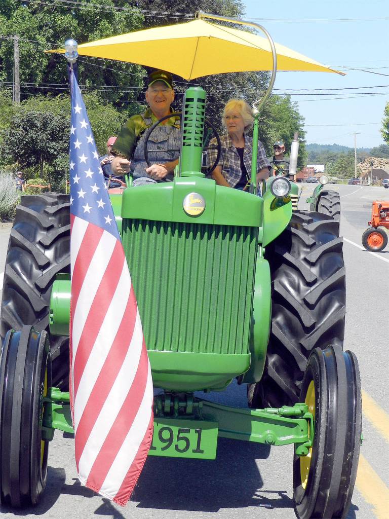 Jim and Peggy Richter drive their antique tractor in the 2015 parade.                                William Shaw/File Photo