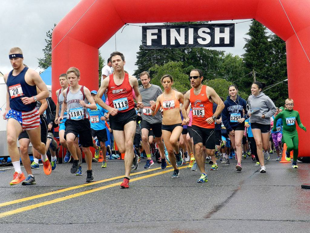 Runners speed start the annual Fall City Days Run on Main Street.                                William Shaw/File Photo
