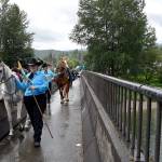 Riders walk their horses over the S.R. 202 bridge after the parade.                                Carol Ladwig/File Photo