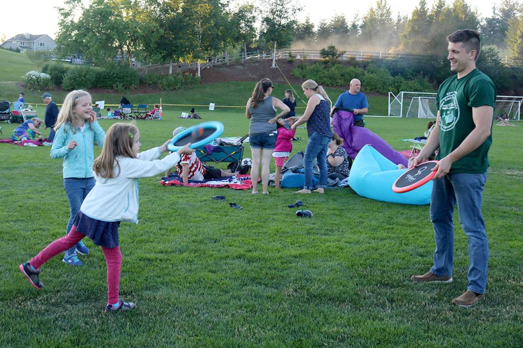 Jeff Smith and his daughter Jocelyn pass a ball back and forth before the show starts. (Evan Pappas/Staff Photo)