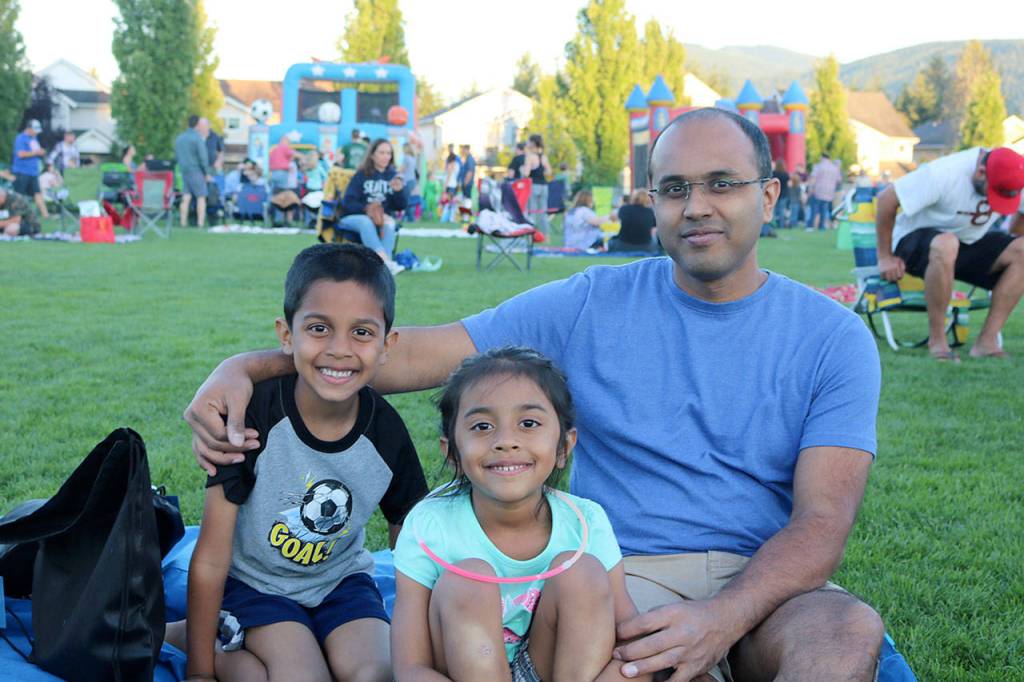 The Patel family gets a spot right in the front row for a great view of the fireworks. From left: Darsh, Miraya, and Mayank Patel. (Evan Pappas/Staff Photo)