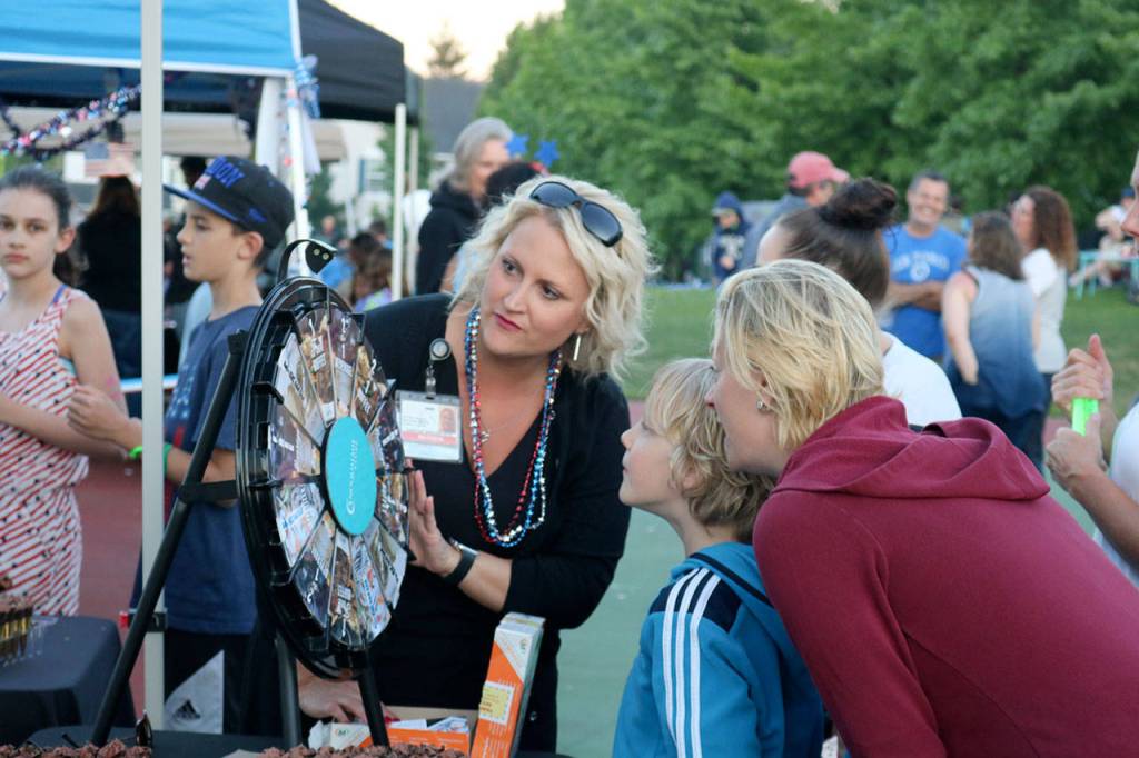Griffin Clarke spins the Snoqualmie Casino&rsquo;s wheel to get one of a variety of prizes. (Evan Pappas/Staff Photo)