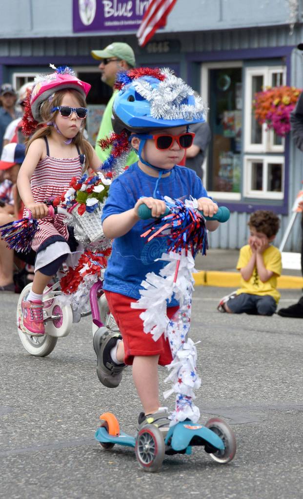 Decorated scooters abounded in the kiddie parade. (Carol Ladwig Staff Photo)