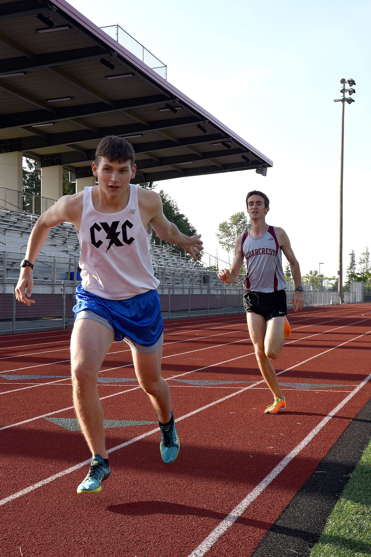 Ben Benson awaits the first handoff from Grant Van Valkenburg, who finished his first lap in 65 seconds. Benson&rsquo;s first lap was 62 seconds.                                Carol Ladwig/Staff Photo