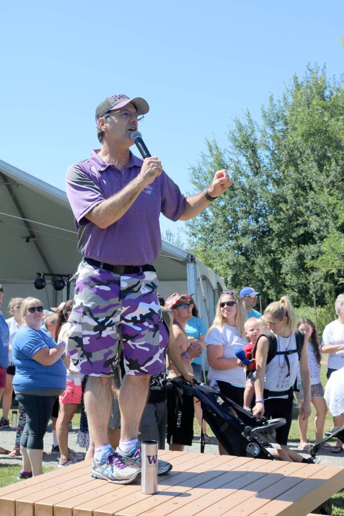JD Drollinger keeps the crowd excited as the survivor march comes back around to the stage. (Evan Pappas/Staff Photo)