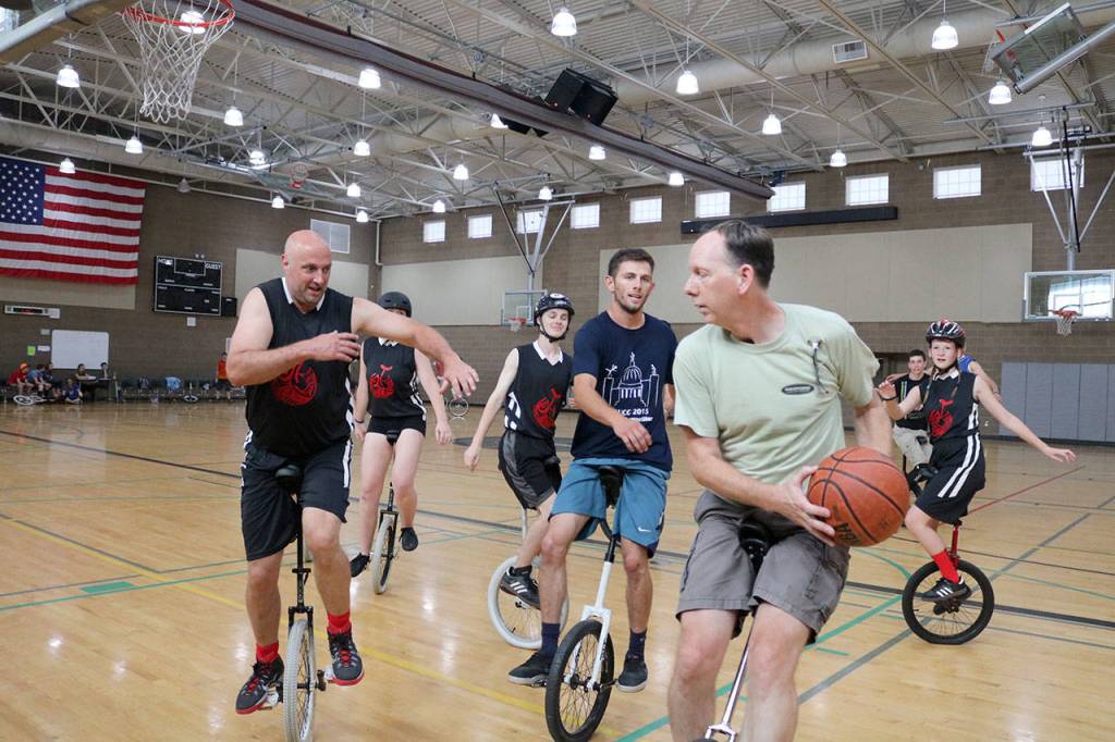 John Foss from Sacramento gets the ball away from the Snoqualmie Valley Unicycle Club&rsquo;s basketball team. (Evan Pappas/Staff Photo)