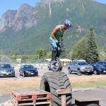 Lucas Clegg of South Dakota navigates a difficult obstacle for critical points in the unicycle trials competition. (Evan Pappas/Staff Photo)