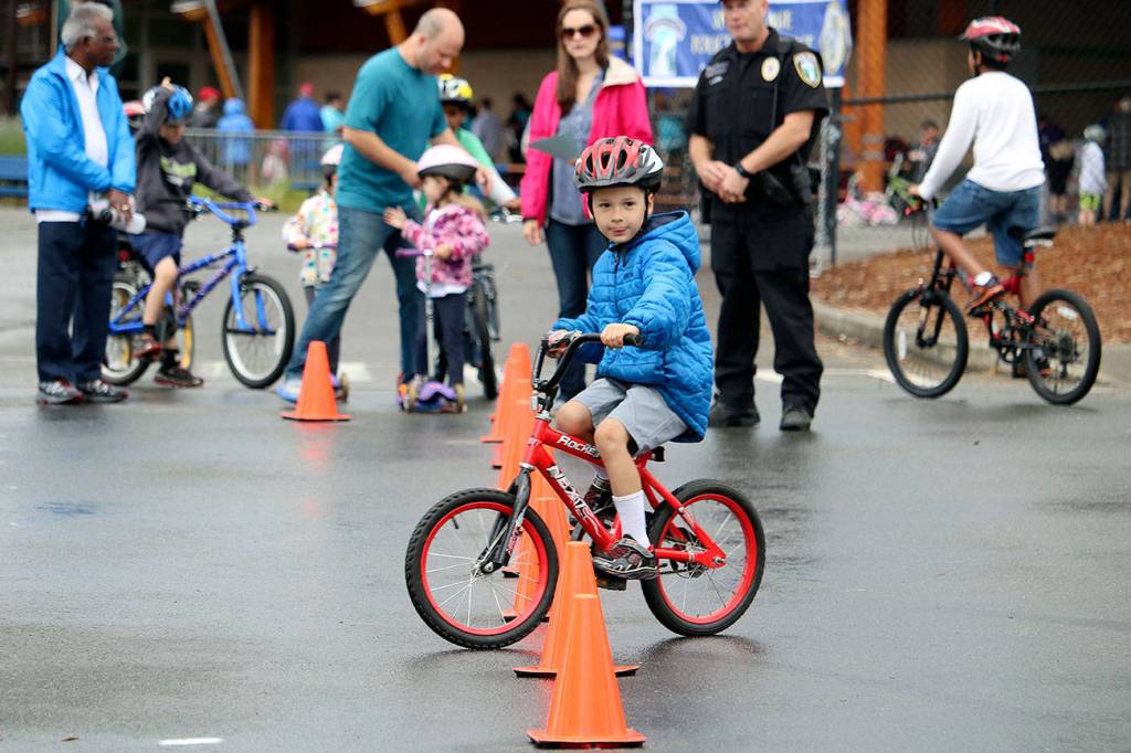 A youngster navigates the obstacle course at the 2016 Bike Rodeo.                                (Evan Pappas/File Photo)