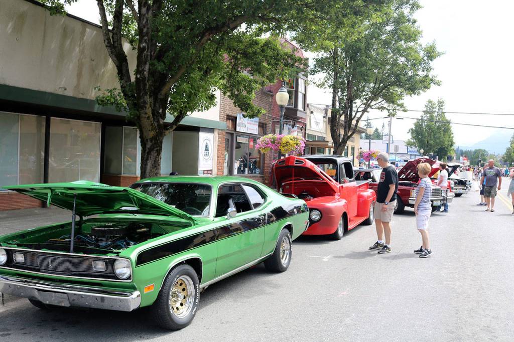 Cars line North Bend way as attendees get a chance to get a close look under the hood. (Evan Pappas/Staff Photo)