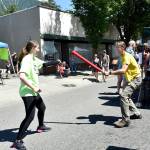 Washington Fencing Academy student Allison Beedle spars with the father of another student, both of them left-handed, at the academy&rsquo;s Block Party booth, Saturday. Carol Ladwig/Staff Photo