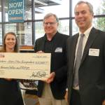 Bartell Drugs staff also announced the company would make a $5,000 donation to Forterra, in support of its Green Cities program. Pictured from left are Senior Marketing Manager ​​Evelyn ​​Barber Merrill​, board member Burt Gregory, ​​and Chief Financial Officer Rob Jensen​.                                (William Shaw/Staff Photo)