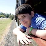 Vincent Arellano of Snoqualmie, looks out the window on the Rails to Trails train ride June 24. He was on the expedition with his father, Mike.                                Photo courtesy of Ray Lapine