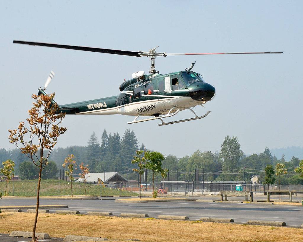 Guardian One arrives at Torguson Park with rescued hiker Kimberly Haines and her dog, Rainey, on board.                                Photo courtesy of Mary Miller