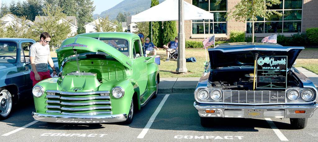 Legends Car Club members brought a preview of the Railroad Days car show to Snoqualmie&rsquo;s National Night Out and Tanner Jeans Bike Rodeo last Tuesday.                                (Carol Ladwig/Staff Photo)