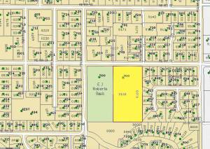 North Bend has reached a purchase agreement for a five-acre parcel of land, highlighted in yellow on this map, next to E.J. Roberts Park. Half the parcel will be used for a single-family home and the other half will either be added to to the park, or to adjoining lots.                                (Courtesy image)