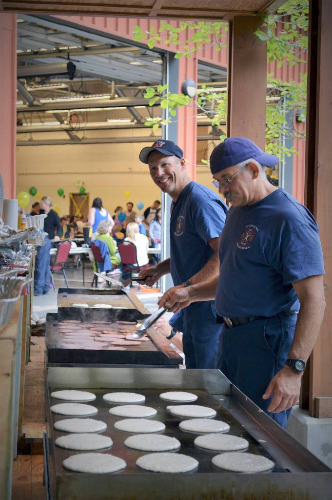 File Photo                                Firefighters cooking up pancakes at the 2016 Pancake Breakfast.