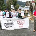 The Snoqualmie Valley Indivisibles march behind their banner at the Festival at Mount Si.                                (Courtesy Photo)
