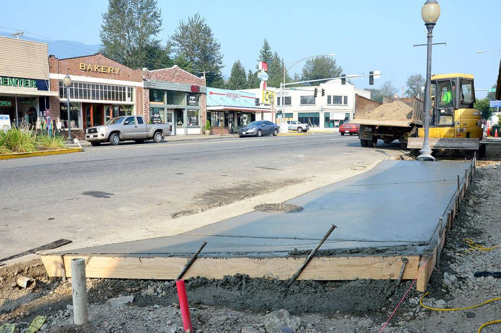 A newly poured sidewalk in North Bend&rsquo;s downtown area cures.                                (Photo courtesy of Mary Miller)