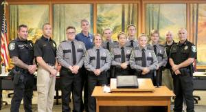 The Snoqualmie Police Explorers were recognized at the Snoqualmie City Council meeting on Monday, Aug. 28. From left: Officer Dmitriy Vladis, Corporal Jason Weiss, Tyler Keller, Mayor Matt Larson, Elizabeth Johanson, Ben Swanzey, Mikayala Garay, Michael Keller, Kristina Woodbury, Tristan Tritten, Officer Richard Cary and Chief Perry Phipps.                                (Evan Pappas/Staff Photo)