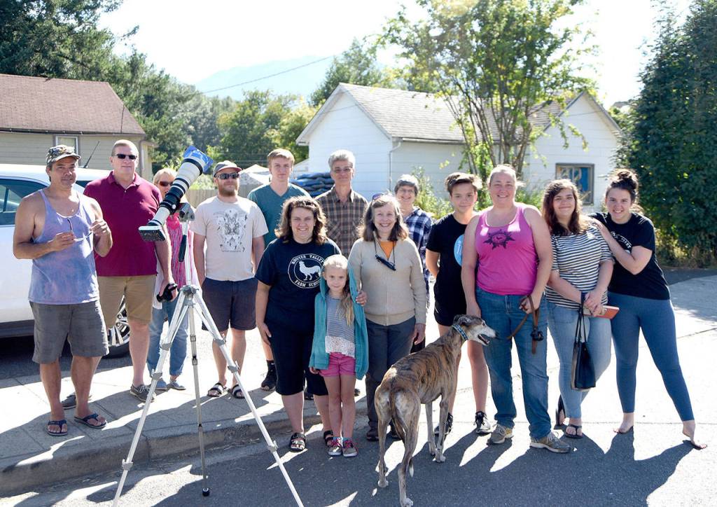 The informal &ldquo;Dodson Observatory&rdquo; eclipse viewing party that gathered outside Carmichael&rsquo;s Hardware, to use Scott Dodson&rsquo;s different viewing devices to witness, and share, the eclipse.                                (Carol Ladwig/Staff Photo)
