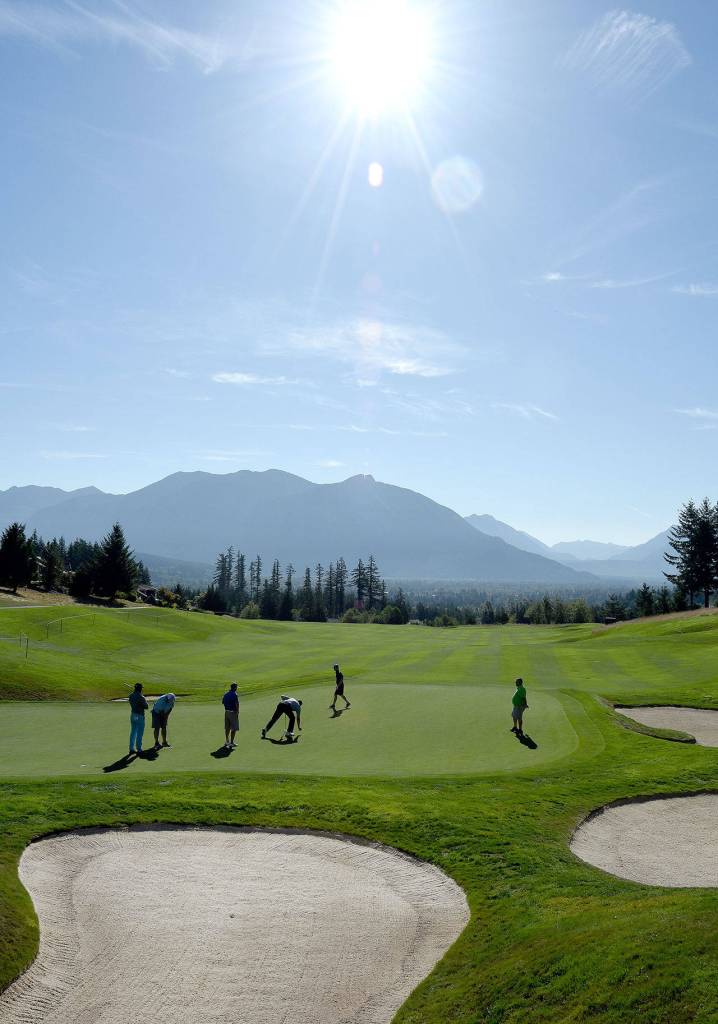 Clear skies and a partial eclipse welcomed pro athletes and company executives to The Club at Snoqualmie Ridge Monday morning, for the start of a week of Boeing Classic events.                                (Carol Ladwig/Staff Photo)