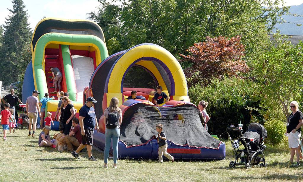 Children and families exhausted themselves Saturday at the bounce houses and other Kids&rsquo; Field of Fun activities at the Snoqualmie Depot.                                (Carol Ladwig/Staff Photo)