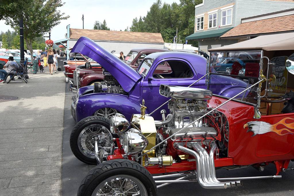 Colorful cars of every age, make and model lined the streets and parking lots of Snoqualmie Sunday.                                (Carol Ladwig/Staff Photo)