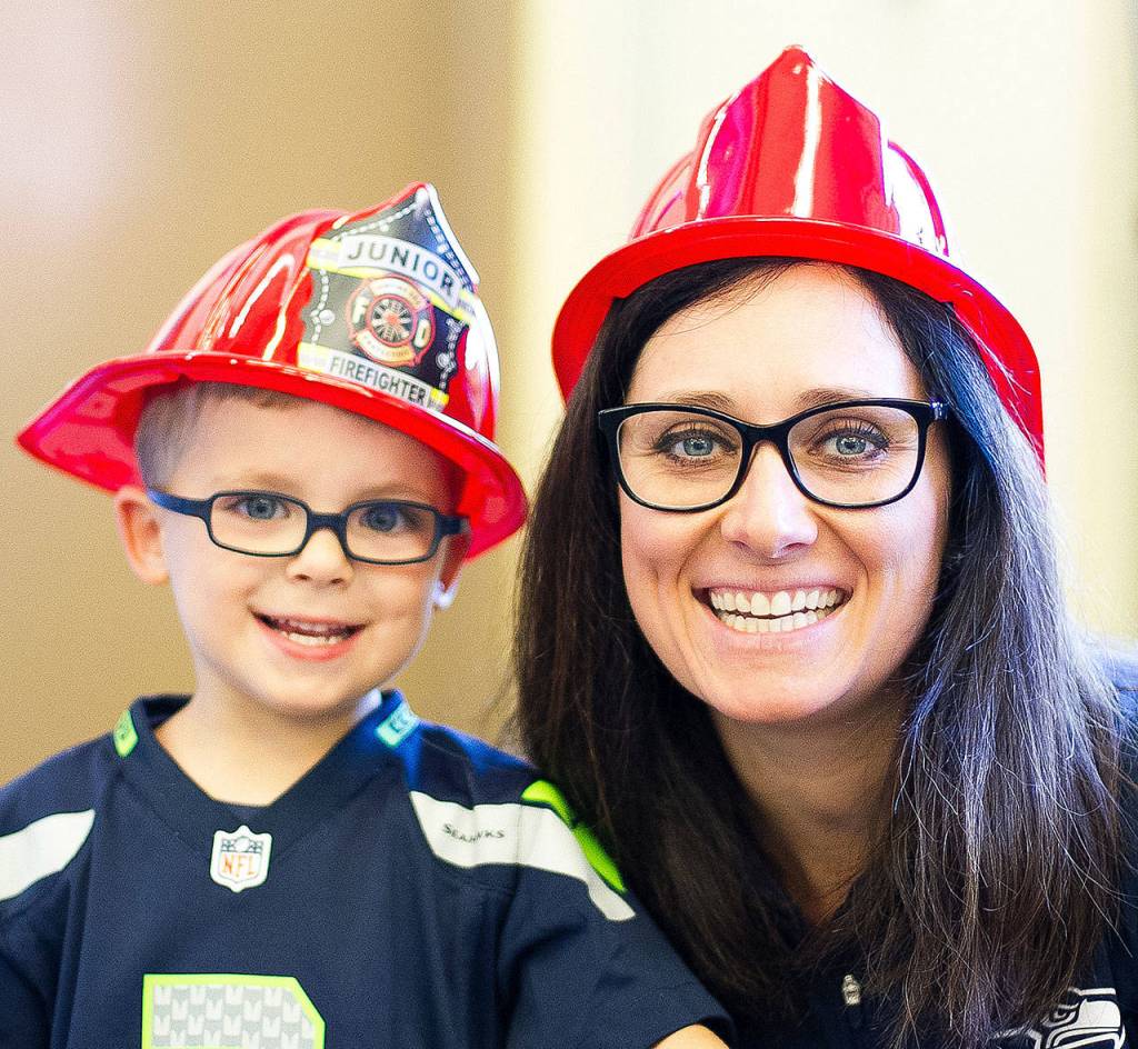 Raechel Frick and her son Henry donned firefighter helmets for Saturday&rsquo;s pancake breakfast.                                (Jessie Koon Photo)