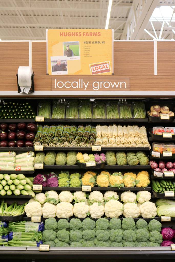 One of the local farm signs that is featured in the produce section. Many farms from around the area are highlighted, along with their contributions to the store.                                (Evan Pappas/Staff Photo)