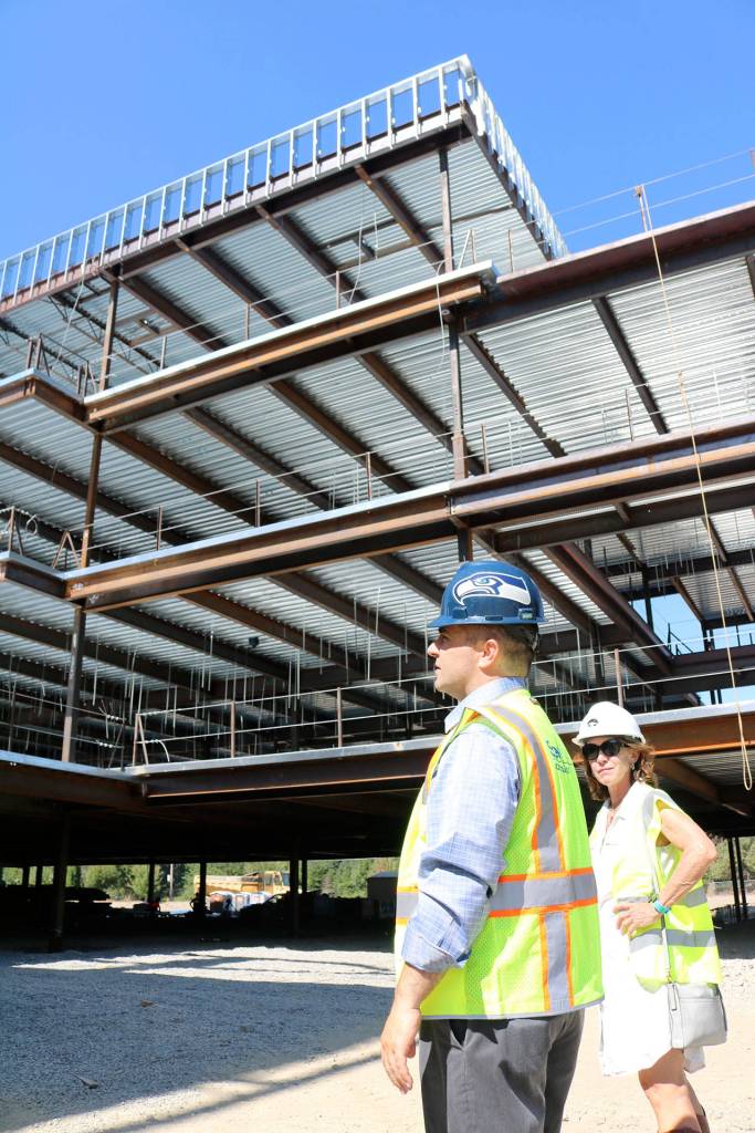 Assistant superintendent Ryan Stokes, left led a tour the high school construction site last week for the Record and school board members, including Carolyn Simpson, right.                                (Evan Pappas/Staff Photo)