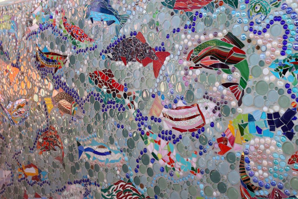 Robin Kelley, executive director of FISH, said that the mural is especially beautiful because the way the sunlight reflects off of the fish changes depending on the time of day. Nicole Jennings/staff photo