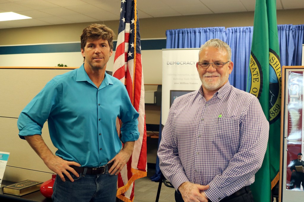 Evan Pappas/Staff Photo                                Democracy Live CEO Bryan Finney, left, and Outreach Director Charlie Kinnune talk about the company&rsquo;s voting software that enables people who can&rsquo;t read ballots to vote.