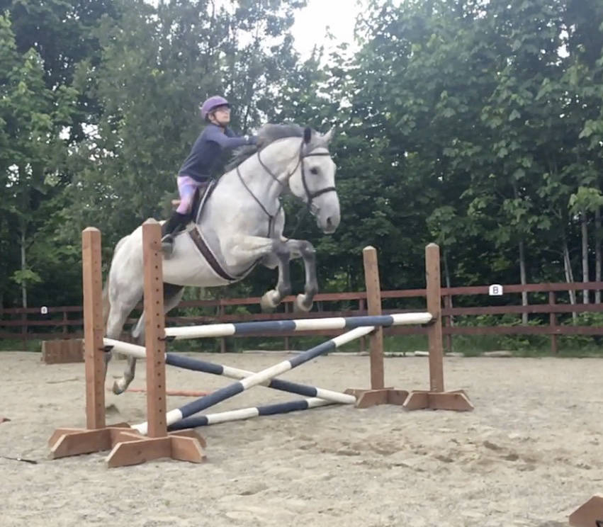 Audrey Newbrey-Smith and her horse Flint make a jump at show in Kirkland. (Courtesy Photo)
