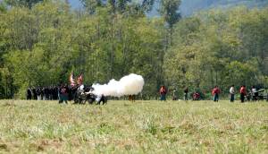 A Union artillery cannon fires at the enemy at the start of a 2016 Civil War battle re-enactment at Meadowbrook Farm.