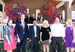 Brown and Sterling staff members, pictured from left are: front - Tina Laguna, Tim Wagar, Larry Brown, Ruth Rogers, Dave Rinn and Jaime Cole; back - Lynn Busser, Sarah Evans, Trishia Porter, Chanda Nowbilski and Jessica Pereira. (Carol Ladwig/Staff Photo)