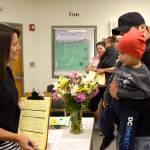 Tony Martinez, holding his 2-year-old son Troy, talks with Fall City Elementary School office staff as school starts for the year. &ldquo;I used to go to this school,&rdquo; he said. Now, he was there to drop off his daughter, Amanda. (Carol Ladwig/Staff Photo)