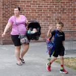 Brody LaBelle waves at friends as his mom, Melissa drops him off at school Wednesday. (Carol Ladwig/Staff Photo)
