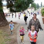 Students run into Fall City Elementary from the playground as the bell sounded the start of the first day of school. (Carol Ladwig/Staff Photo)