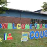 Eleanor, Eva and Alex McLean all stand by the welcome sign put up at Snoqualmie Elementary by the PTSA. (Evan Pappas/Staff Photo)