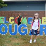 Nolan and Paisley Wais shake off the nerves of stating a new year at school before heading inside. (Evan Pappas/Staff Photo)