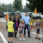 Student crossing guards lead parents and students from the parking lot to Snoqualmie elementary safely. (Evan Pappas/Staff Photo)