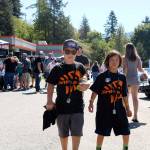 Titus Wilhelm, 9, and Isaih Lee-Akre, 8, enjoyed a sunny day &ldquo;looking at cool cars&rdquo; at DirtFish.                                (Evan Pappas/Staff Photo)